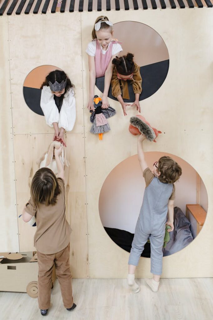 Kids play joyfully with puppets and toys in a creative indoor playroom, emphasizing fun and friendship.